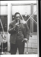 Coltrane smokes a pipe while taking a break from recording A Love Supreme at Van Gelder Studios, Dec. 1964